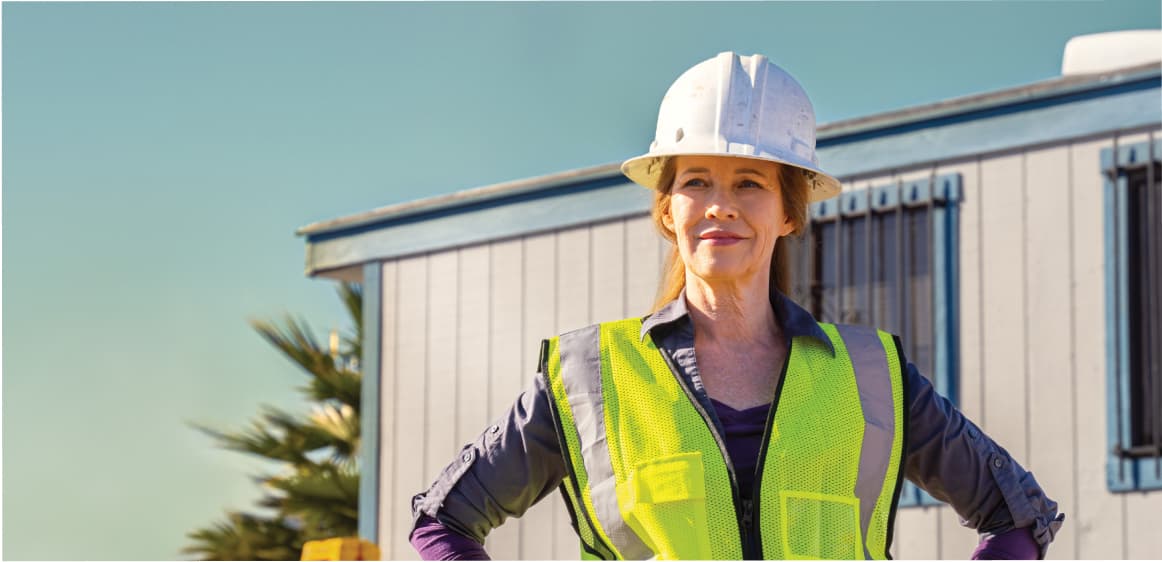 Woman wearing a hardhat on a construction site